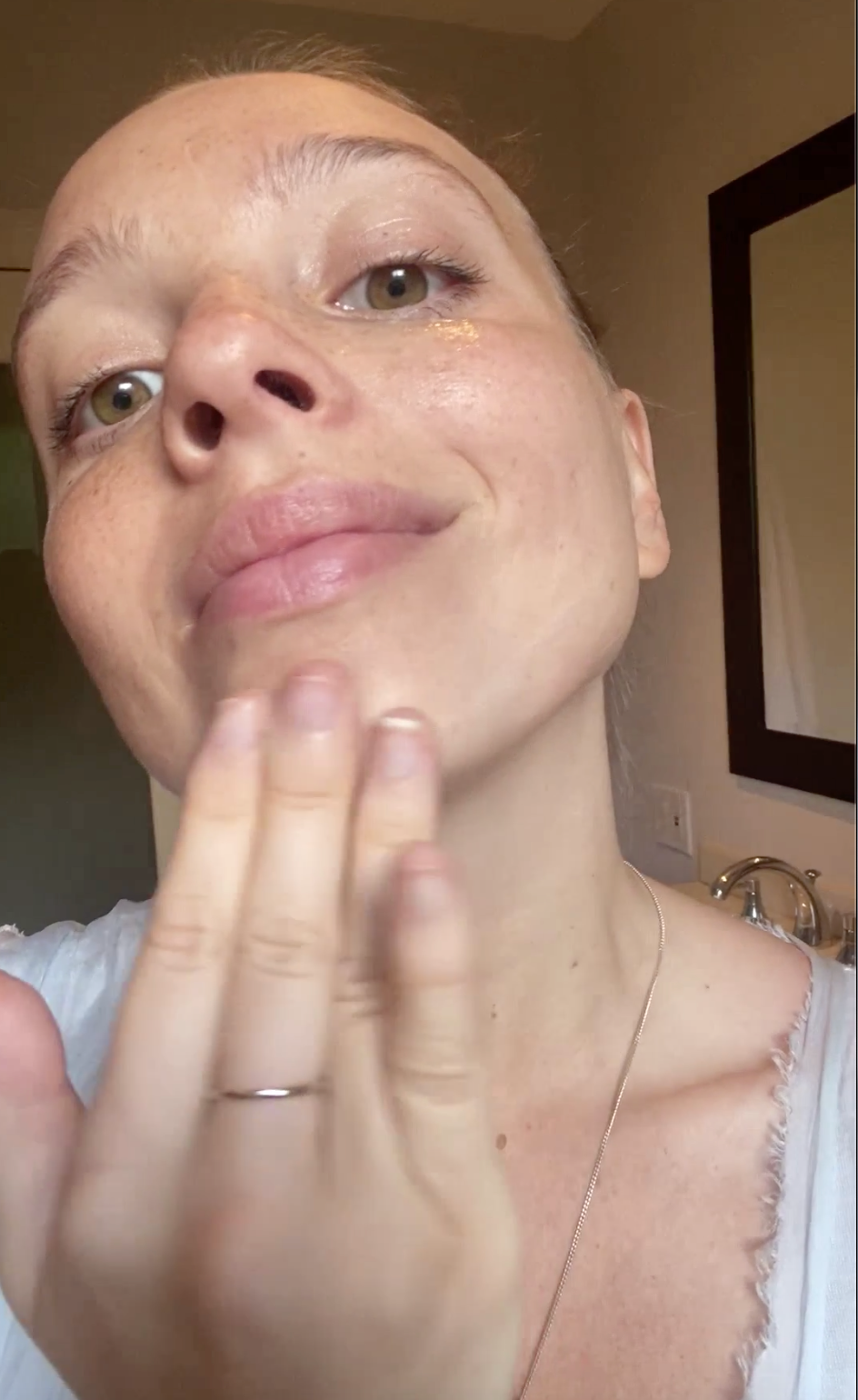 Video of a young woman applying Phyto Clear botanical retinol gel cream and moisturize.