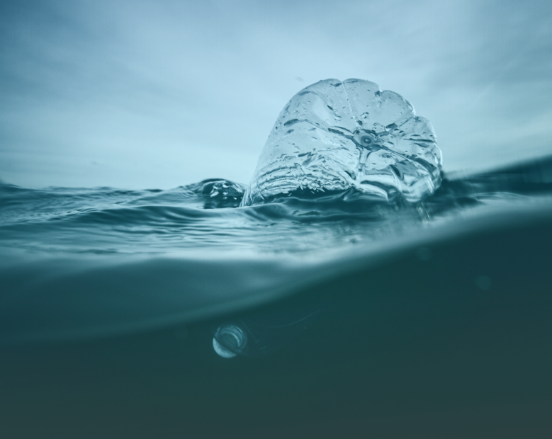 Plastic water bottle floating in ocean